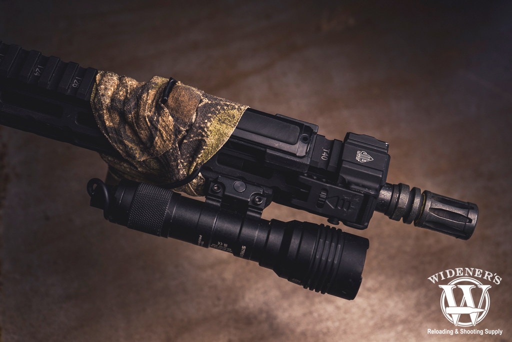 flash hider installed on a rifle barrel a photo of a flash hider installed on a rifle barrel