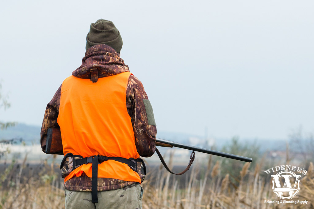 a man pheasant hunting outdoors