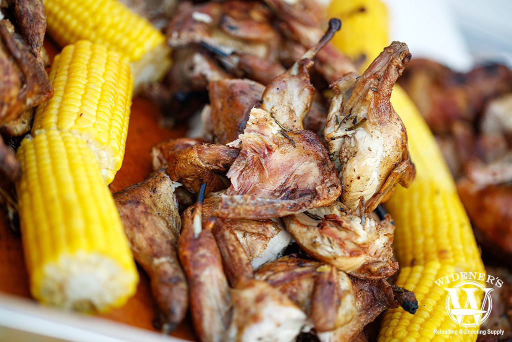a photo of game hens roasted with yellow corn