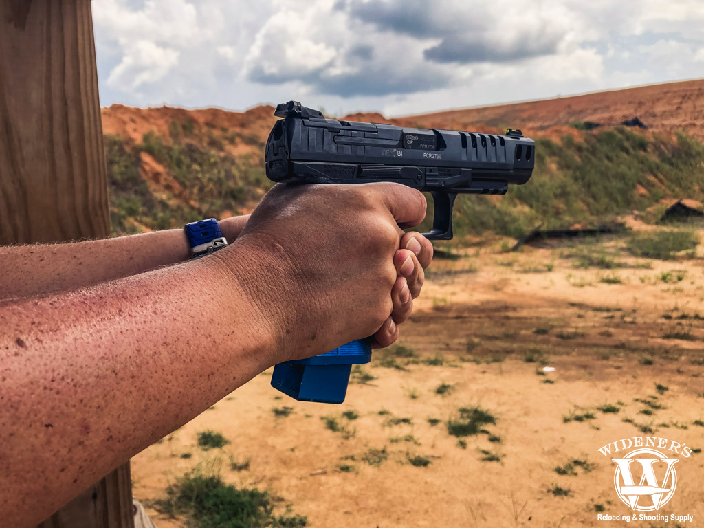 a photo of a competition pistol being shot at a gun range
