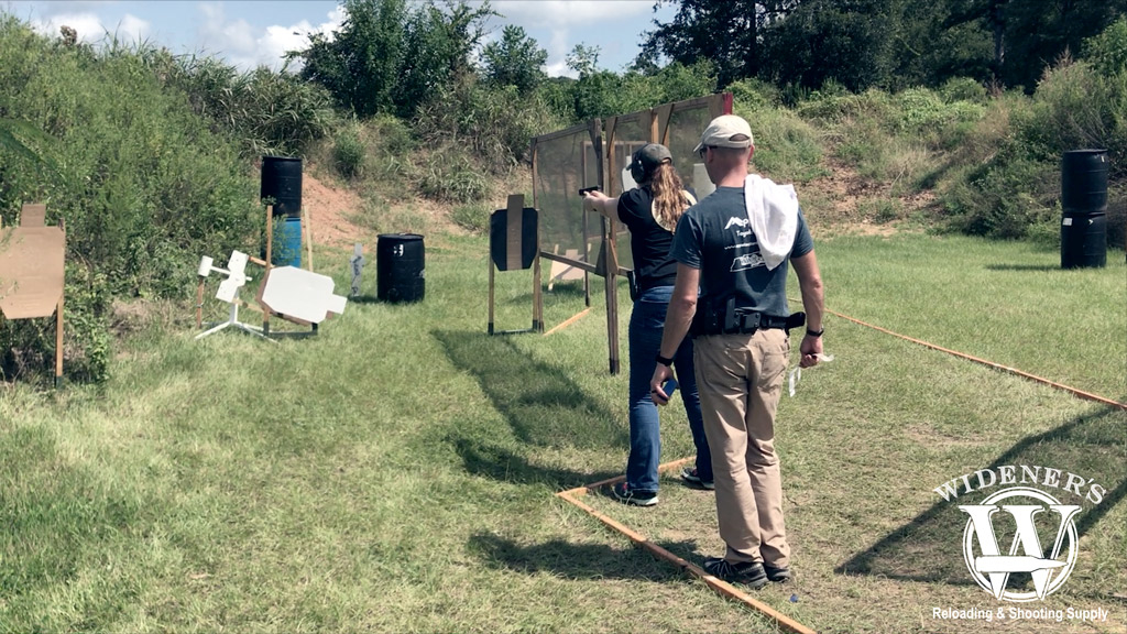 photo of competition shooting female at the gun range