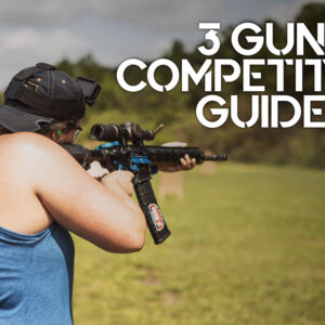 a photo of a female shooting guns at 3 gun competition