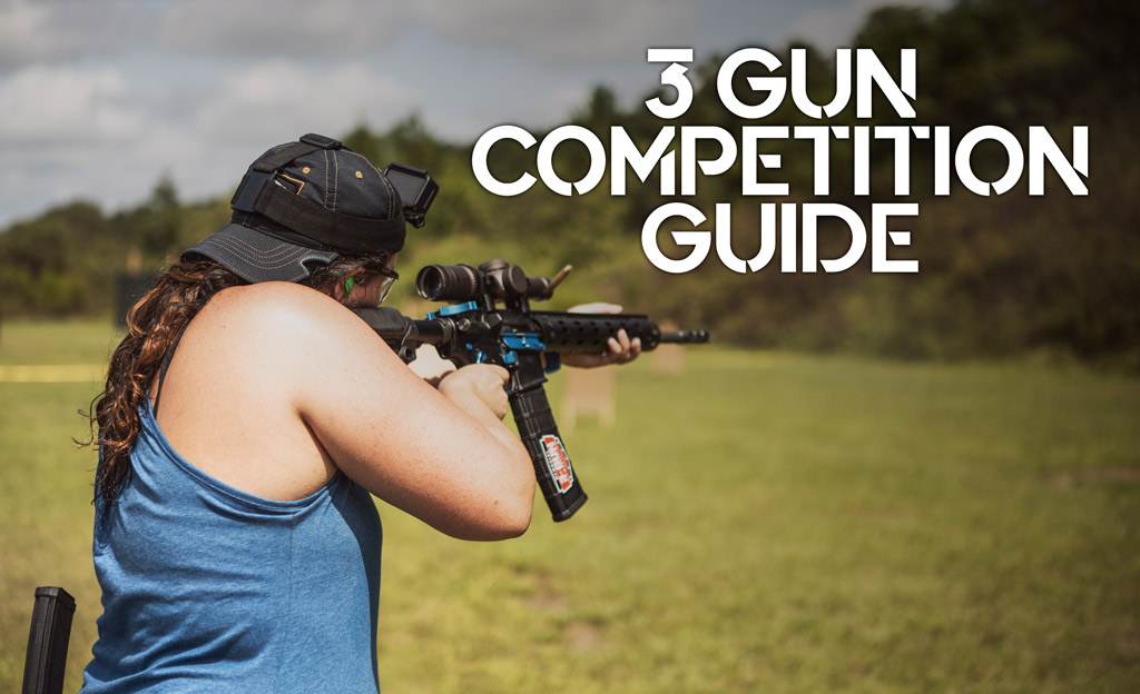 a photo of a female shooting guns at 3 gun competition