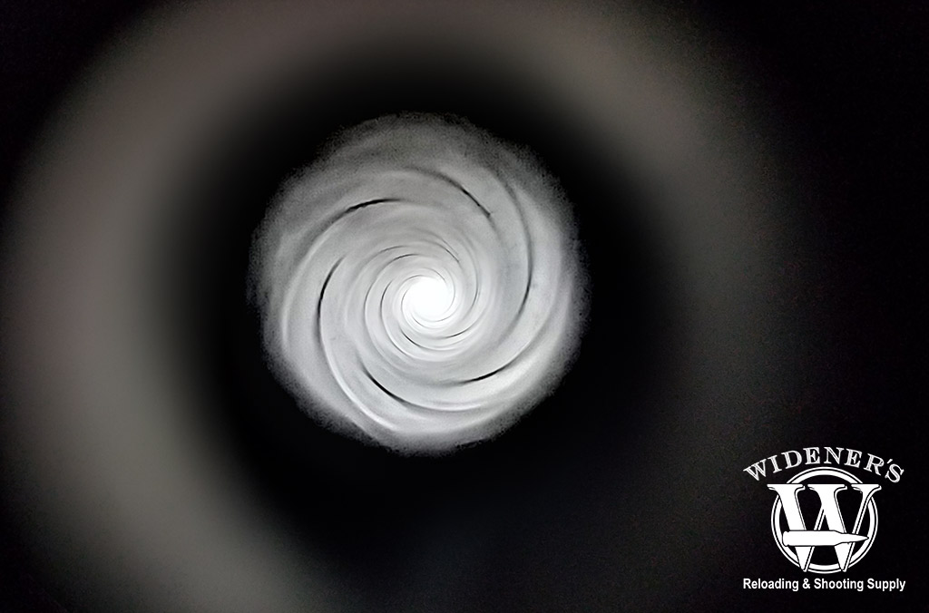 a photo looking down the barrel of an ar-15 rifle