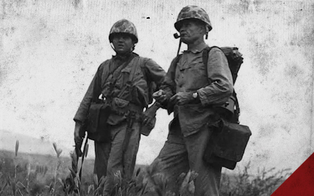 a photo of two marines on the WWII battlefield 