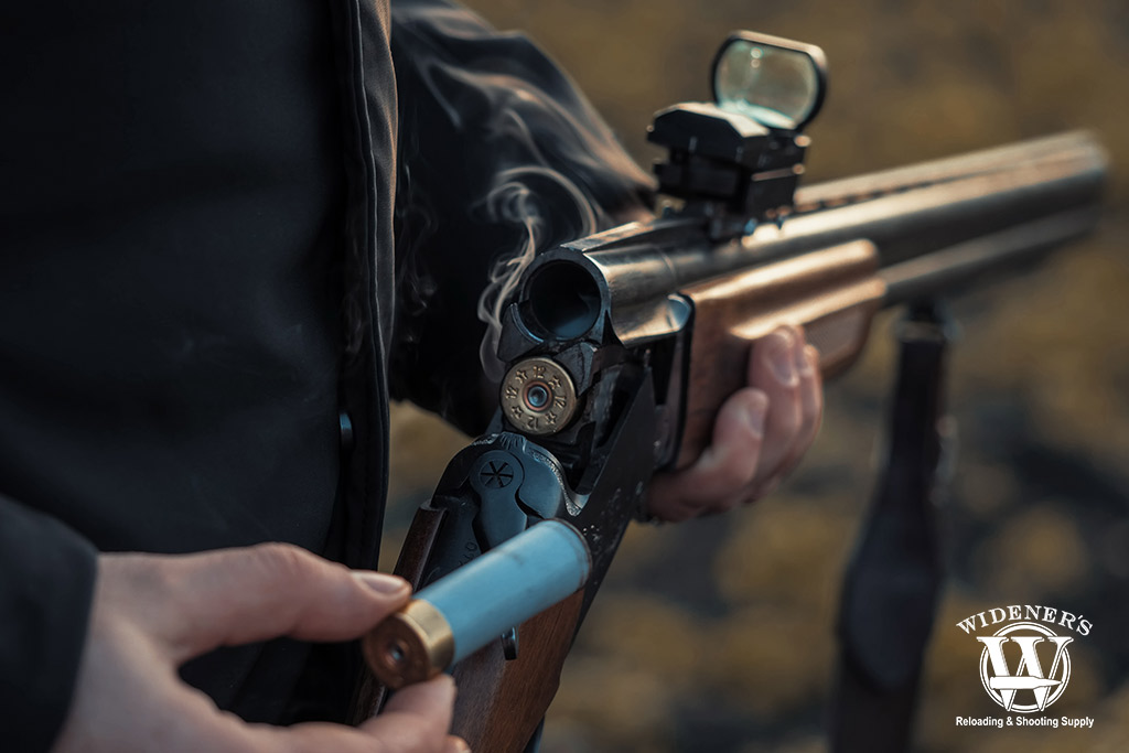 a photo of a reflex sight mounted on a shotgun