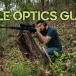 a man shooting with rifle optics