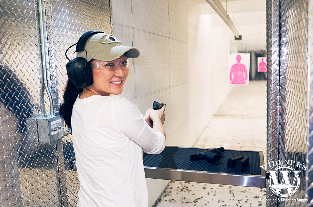 a photo of a female at a shooting range