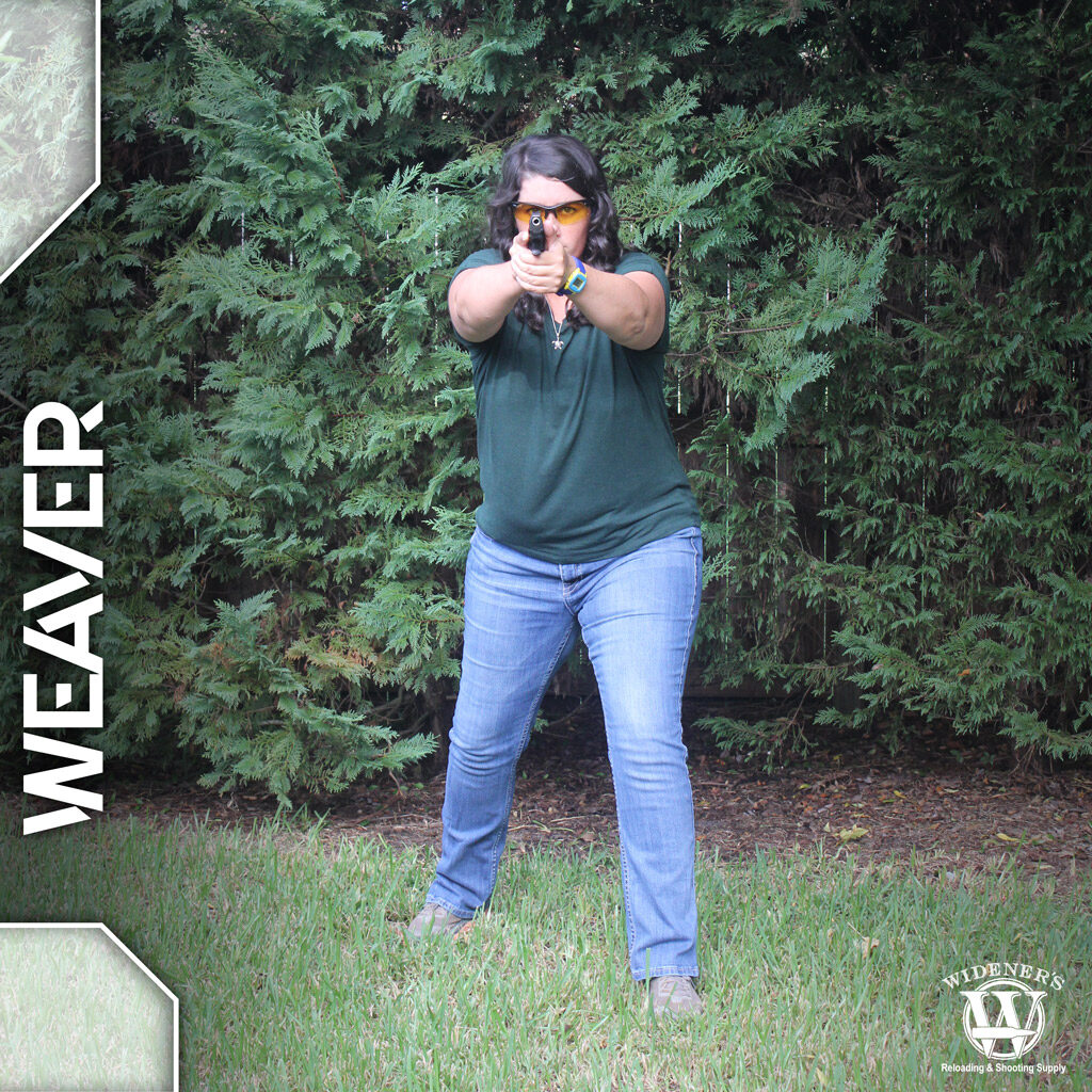 a photo of a female instructor demonstrating weaver pistol shooting stances
