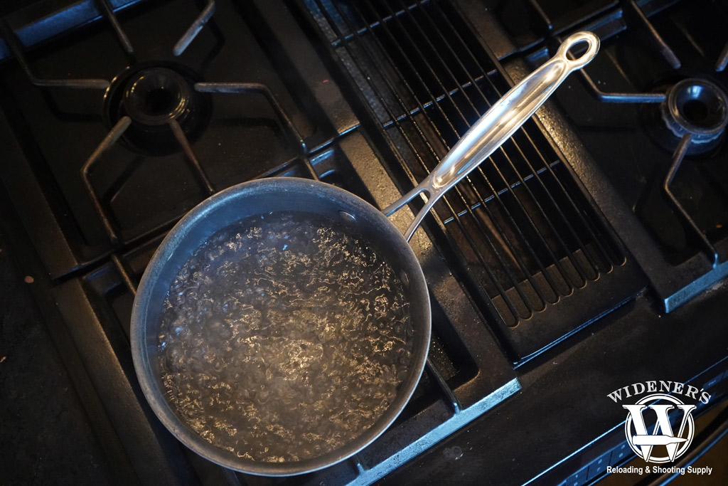 a photo of a pot of water boiling on a stove top