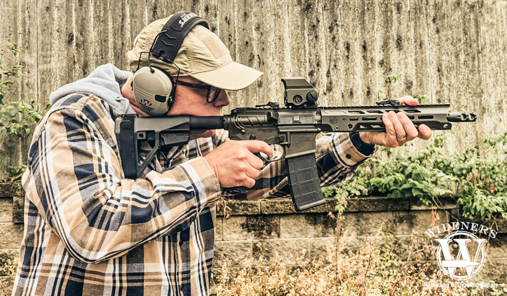 a photo of a man shooting a Diamondback Obsidian Pistol